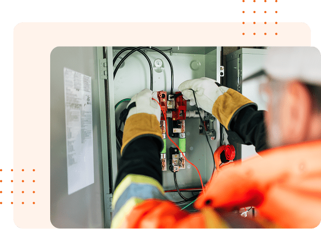 Worker handling electrical wiring tasks